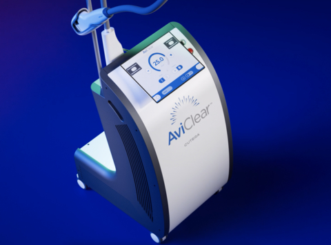 The image shows a robotic vacuum cleaner with a digital display screen on its front and side, indicating cleaning progress or settings, placed against a blue background.