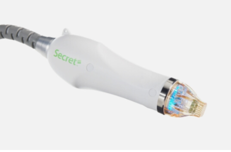 An image of a USB cable plugged into a device with a blue light illuminated, against a white background.
