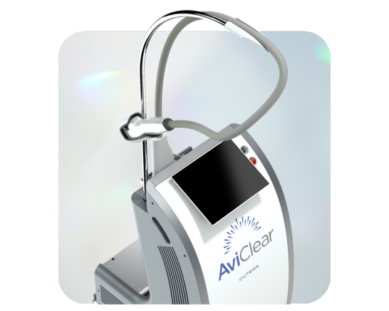 The image shows a medical device with a digital display, connected to a small machine with a hose attachment, likely for patient monitoring or treatment.