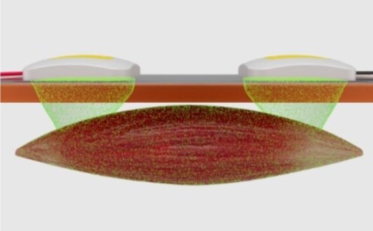 The image shows a device with a transparent surface displaying two objects that appear to be floating in mid-air against a dark background, with a red substance beneath them.